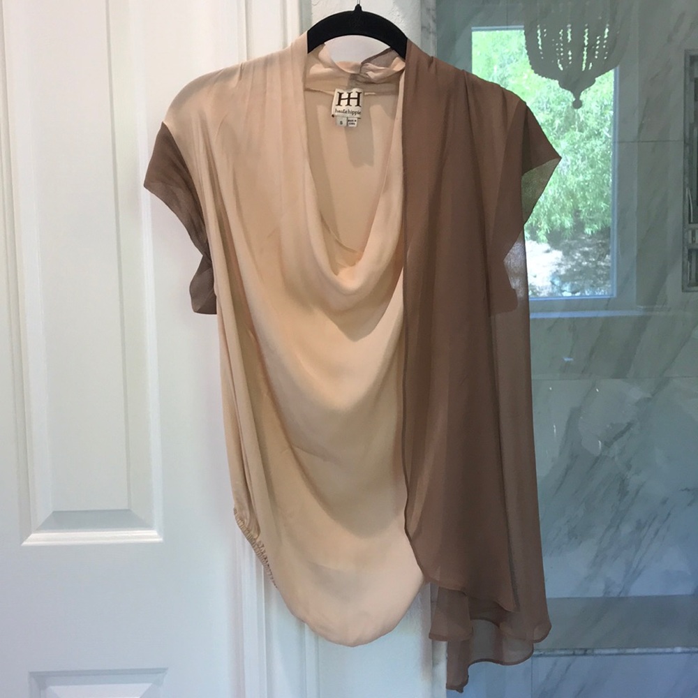 Hautehippe sheer blouse with shoulder drape.